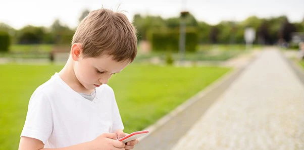 Chiropractic Nelson Tasman Child on Cell Phone